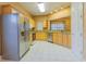 Bright kitchen featuring stainless steel appliances, light wood cabinets, and tile floors at 2418 Formosa Ave, Orlando, FL 32804