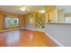 Inviting living room with hardwood floors, a ceiling fan and a glimpse of the staircase at 2418 Formosa Ave, Orlando, FL 32804