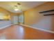 Open living area with hardwood floors, natural light, and kitchen access at 2418 Formosa Ave, Orlando, FL 32804