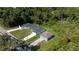 Aerial shot of three homes surrounded by lush trees, capturing a serene neighborhood setting at 248 S Virginia Ave, Deland, FL 32724