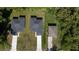 Overhead view of three houses with neat lawns, showing uniformity and green surroundings at 248 S Virginia Ave, Deland, FL 32724