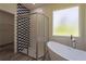 Modern bathroom featuring a large shower, freestanding tub, and designer tile at 248 S Virginia Ave, Deland, FL 32724