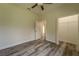 Bedroom with wood floors, closet, and ensuite bathroom access at 248 S Virginia Ave, Deland, FL 32724