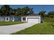 A charming single-story house with a well-kept lawn and a two-car garage on a sunny day at 248 S Virginia Ave, Deland, FL 32724