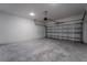 Spacious two car garage with white block walls, concrete floor, and an automatic garage door opener at 248 S Virginia Ave, Deland, FL 32724