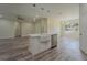 Modern kitchen with island, stainless steel appliances, recessed lighting, and ample storage at 248 S Virginia Ave, Deland, FL 32724