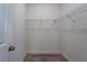 Walk-in closet with wire shelving and wood floors at 248 S Virginia Ave, Deland, FL 32724
