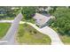 Aerial view of a single-Gathering home with a long driveway, lush landscaping, and a well-maintained yard at 25 Pine Glen Dr, Debary, FL 32713