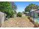 Backyard featuring lush banana trees along the fence line at 25 Pine Glen Dr, Debary, FL 32713