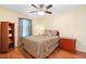 Comfortable bedroom with wood floors, and a well-lit ceiling fan at 25 Pine Glen Dr, Debary, FL 32713