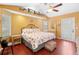 Bright bedroom with unique decorations, wood floors, and lots of light at 25 Pine Glen Dr, Debary, FL 32713