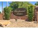Woodbound Lakes brick community sign surrounded by green shrubs and rock ground cover at 25 Pine Glen Dr, Debary, FL 32713