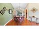Elegant dining room with hardwood floors and a decorative light fixture at 25 Pine Glen Dr, Debary, FL 32713