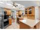 Functional kitchen featuring ample counter space, stainless steel appliances, and tiled backsplash at 25 Pine Glen Dr, Debary, FL 32713