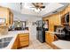 Spacious kitchen with stainless steel appliances and wood cabinets at 25 Pine Glen Dr, Debary, FL 32713