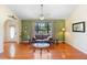 Inviting living room featuring hardwood floors, a comfortable seating area, and a large window at 25 Pine Glen Dr, Debary, FL 32713