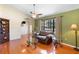 Comfortable living room with vaulted ceilings, a ceiling fan, and beautiful hardwood floors at 25 Pine Glen Dr, Debary, FL 32713