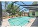 The in-ground pool has a screened enclosure and tile trim, perfect for enjoying a swim at 25 Pine Glen Dr, Debary, FL 32713