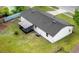 Aerial view of the home's backyard featuring a screened in patio and well-kept lawn at 2517 Oak Hollow Dr, Kissimmee, FL 34744