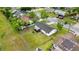 Aerial view of home with a fenced yard and screened in patio in a residential neighborhood at 2517 Oak Hollow Dr, Kissimmee, FL 34744