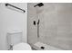 This bathroom features a modern tiled shower with a black shower head at 2517 Oak Hollow Dr, Kissimmee, FL 34744