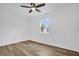 This bedroom features wood flooring and a window at 2517 Oak Hollow Dr, Kissimmee, FL 34744