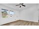 Bright, airy bedroom with modern flooring, fresh paint, and plenty of natural light from two large windows at 2517 Oak Hollow Dr, Kissimmee, FL 34744