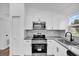 A well-lit kitchen showcases modern appliances, sleek countertops, and contemporary finishes at 2517 Oak Hollow Dr, Kissimmee, FL 34744