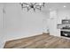 Open-concept living area with modern lighting, sleek flooring, and a view into the updated kitchen at 2517 Oak Hollow Dr, Kissimmee, FL 34744