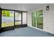 This patio features screened in windows and a sliding glass door at 2517 Oak Hollow Dr, Kissimmee, FL 34744