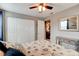 Well-lit bedroom featuring ceiling fan, closet, and access to the rest of the house at 26 Ocean Shore Dr, Ormond Beach, FL 32176