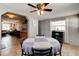 Dining room with a round table, comfortable seating, and an open view of the living area at 26 Ocean Shore Dr, Ormond Beach, FL 32176