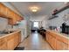 Well-lit kitchen with efficient layout, wooden cabinetry, and open view to the living area at 26 Ocean Shore Dr, Ormond Beach, FL 32176