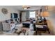 Stylish living room featuring modern furnishings, a decorative rug, and a welcoming atmosphere at 26 Ocean Shore Dr, Ormond Beach, FL 32176