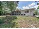 Lush backyard featuring a large screened-in porch and ample space for outdoor enjoyment at 2842 English Dr, Deltona, FL 32738