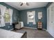 Inviting bedroom with soft carpeting and a cozy work desk next to sunlit windows with white curtains at 2842 English Dr, Deltona, FL 32738