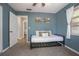 Comfortable bedroom features carpet, a bed, and a window that brings in natural light to the space at 2842 English Dr, Deltona, FL 32738