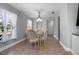 Bright dining room with a chandelier, neutral walls, tile flooring, and a window providing natural light at 2842 English Dr, Deltona, FL 32738
