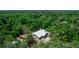 Secluded home surrounded by lush greenery with a metal roof at 2953 Sled Rd, Christmas, FL 32709