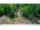 Aerial view of backyard, showing a wooden deck and fenced area at 2953 Sled Rd, Christmas, FL 32709