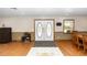 Inviting foyer with hardwood floors, a decorative double door, and natural light from a nearby window at 2953 Sled Rd, Christmas, FL 32709