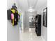 Hallway with tile floors, decorative shelving, and easy access to other rooms at 2953 Sled Rd, Christmas, FL 32709