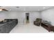Spacious living room with a comfortable sectional, an accent chair, and tile flooring at 2953 Sled Rd, Christmas, FL 32709