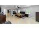 Spacious main bedroom with tiled floors, large windows, and closet with mirrored doors allowing for lots of natural light at 2953 Sled Rd, Christmas, FL 32709
