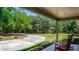 Cozy patio overlooking the backyard, perfect for relaxing and enjoying the peaceful surroundings at 2953 Sled Rd, Christmas, FL 32709