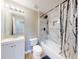 Bathroom featuring a shower/bath combo with updated shower head and vanity at 2978 Greynolds St, Deltona, FL 32738
