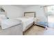 Bright bedroom featuring a crib, changing table and lots of natural light at 2978 Greynolds St, Deltona, FL 32738