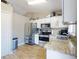 Well-equipped kitchen featuring stainless steel appliances, light countertops, and plentiful cabinet space for storage at 2978 Greynolds St, Deltona, FL 32738