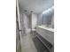 Clean bathroom featuring a shower and white vanity at 3003 S Atlantic Ave # 17A1, Daytona Beach Shores, FL 32118