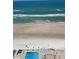 Beautiful ocean view featuring an in-ground pool and inviting lounge chairs at 3003 S Atlantic Ave # 17A1, Daytona Beach Shores, FL 32118
